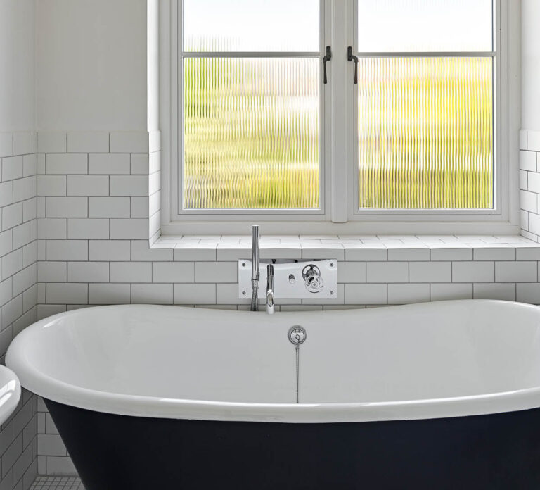 Timber window with reeded glass in a bathroom