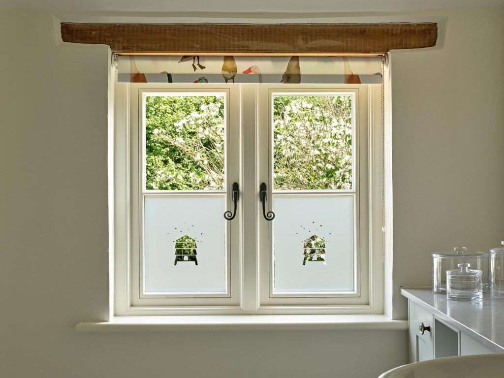 Frosted behives in a timber casement window