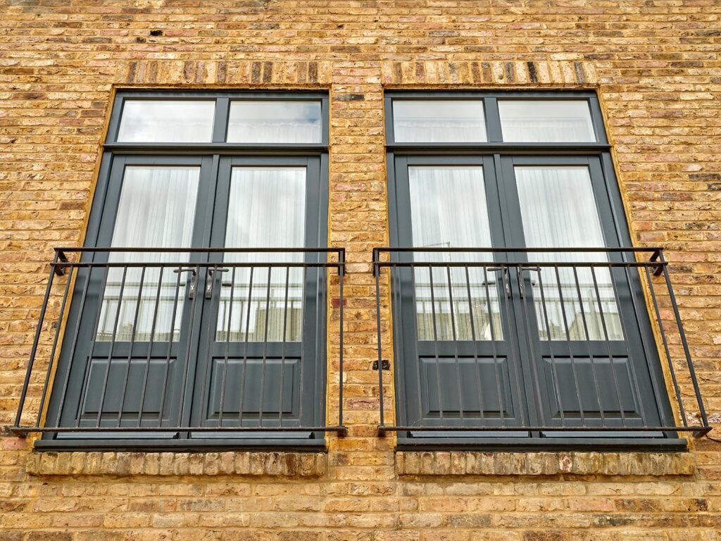 Timber French doors with Julia balconies