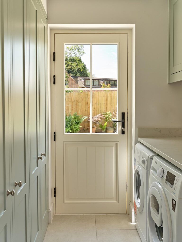 A timber back door made by Sashed in a utility room