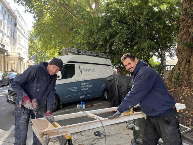 The Sashed restoration team, with a van in the background