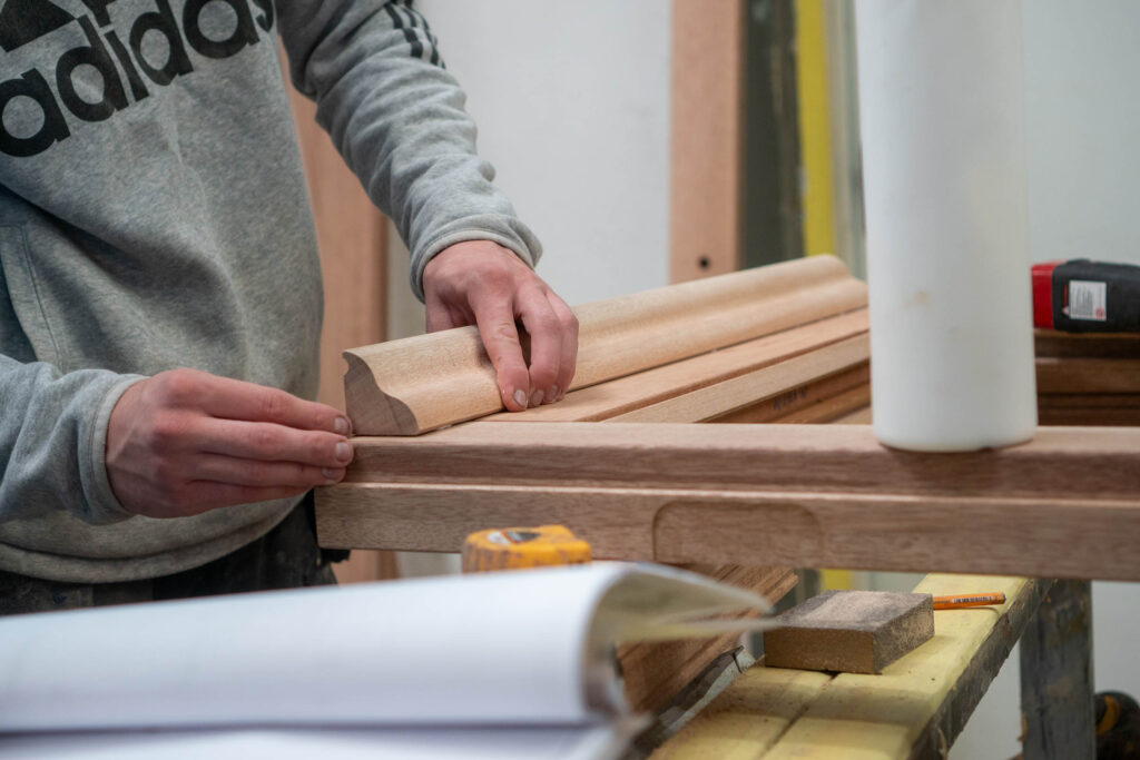 A person making a hardwood door