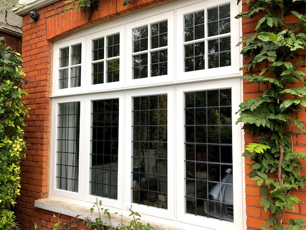 A large wood casement window in Queen's Park, North London