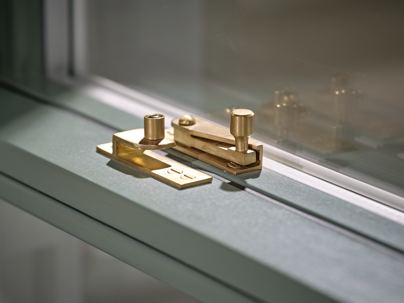 Sash window fastener in satin brass