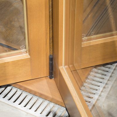 An opening corner timber door