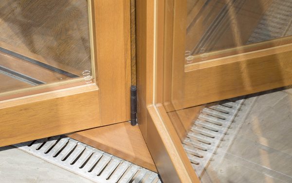 An opening corner timber door