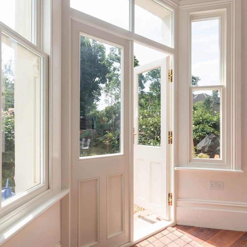 timber French doors with sash windows either side manufactured by Sashed
