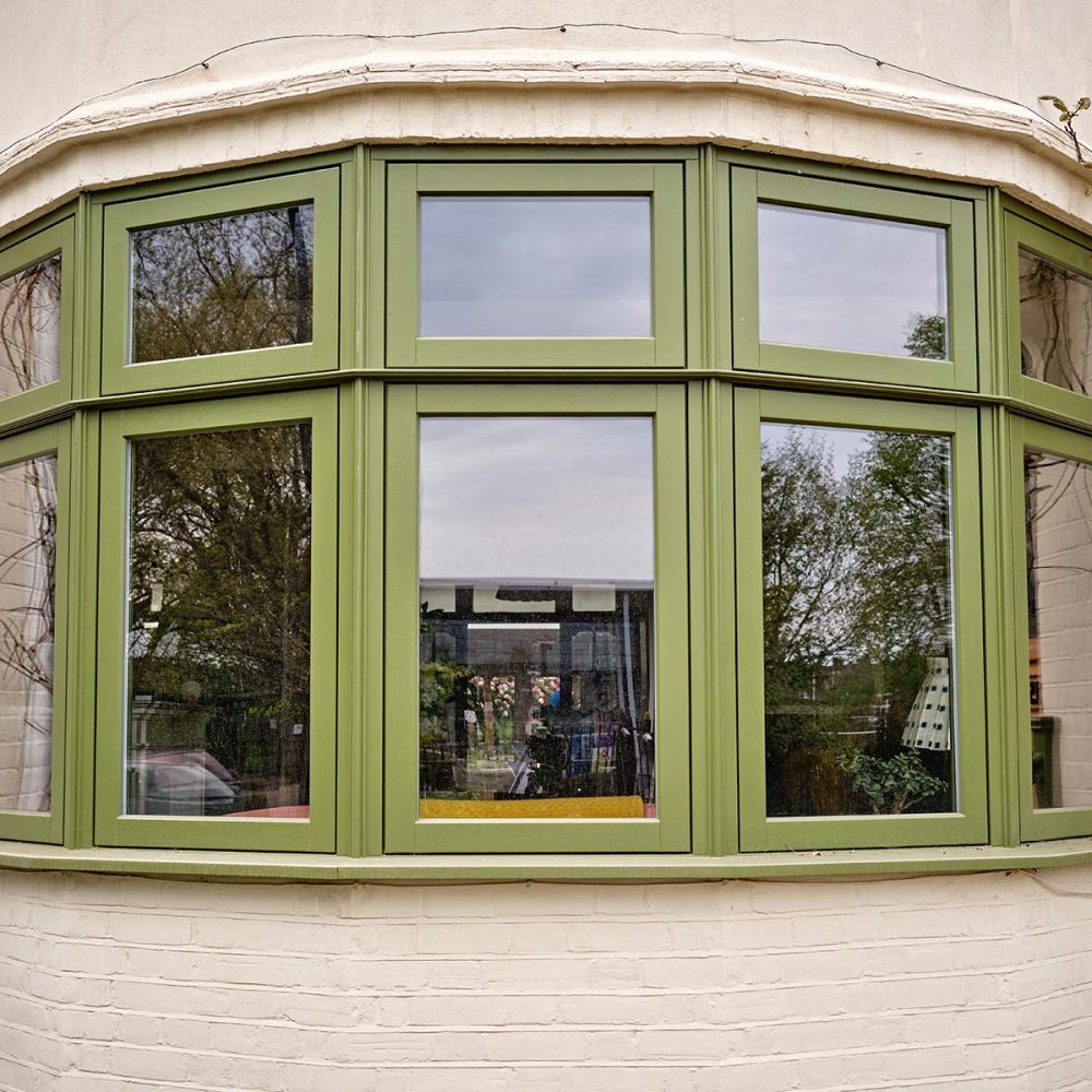 A timber casement Bay finished in Farrow and Ball Bancha