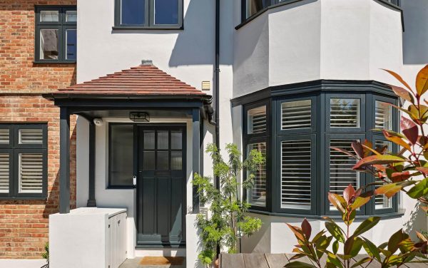 Angled timber bay of casements outside view