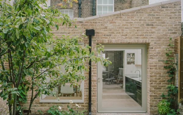 Timber pivot doors painted green made and installed by Sashed