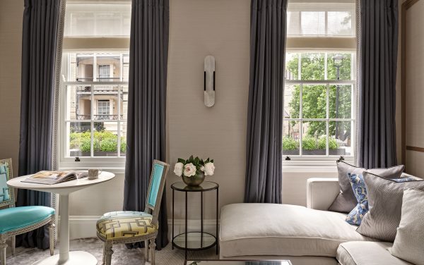 Two a Accoya windows in a living room with curtains either side and a sofa in Bulgaria central London