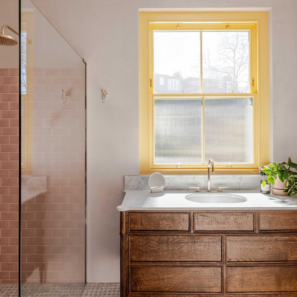 Timber sash in a bathroom painted yellow