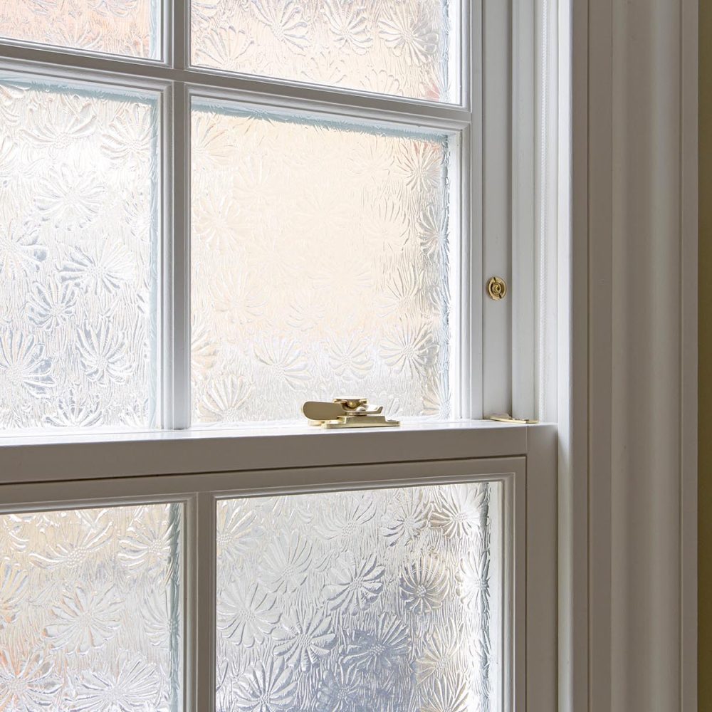 Timber sash window with mayflower obscure glass