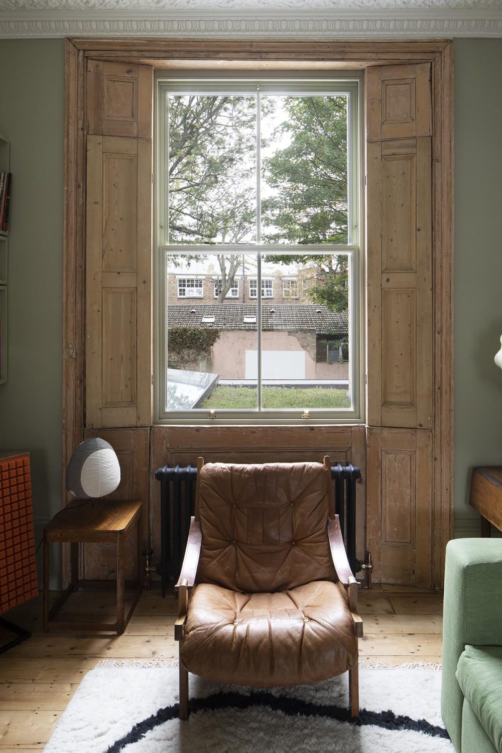 timber sash window with strained shutters
