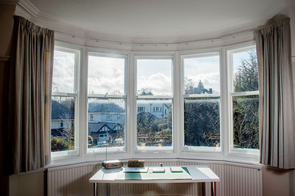 large bay window with secondary glazing in front of sash window