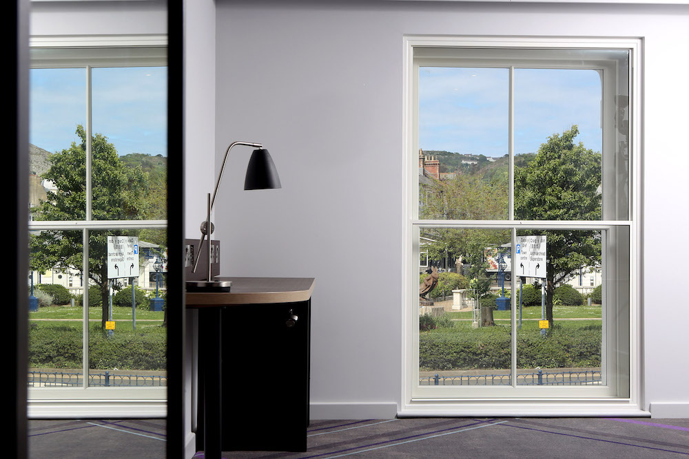 image showing a room with two sash windows and aluminium secondary glazing in front of each sash window