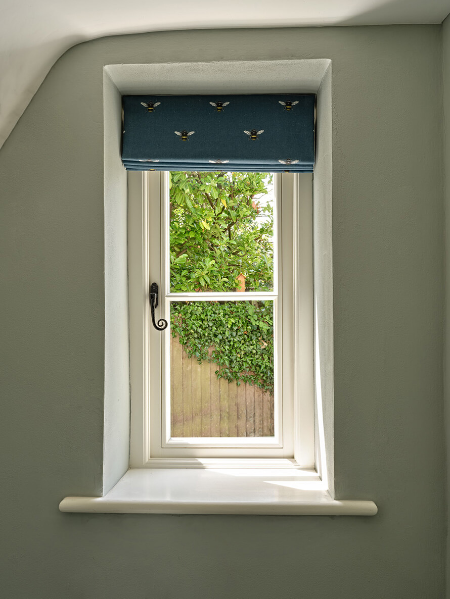 Flush casement window with black monkey tail handle