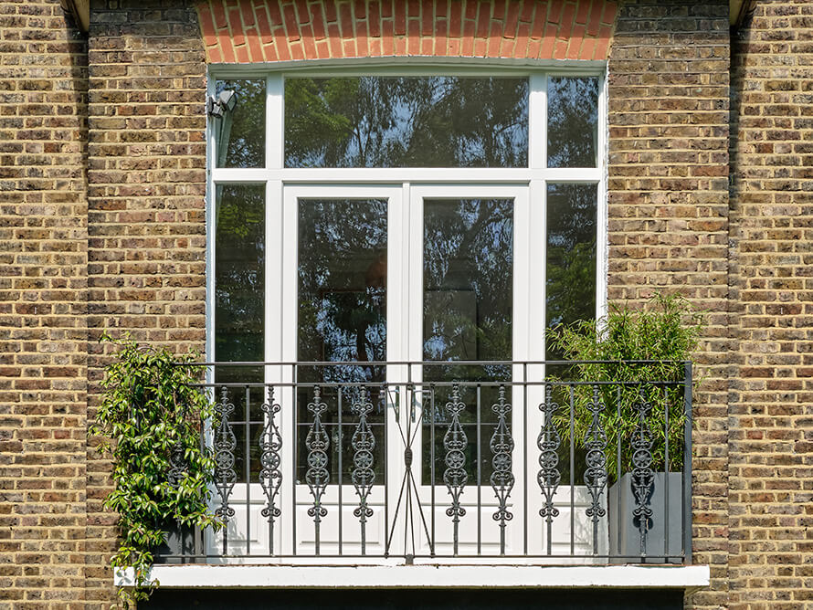 Hardwood French doors in a hallway in Lewisham London.