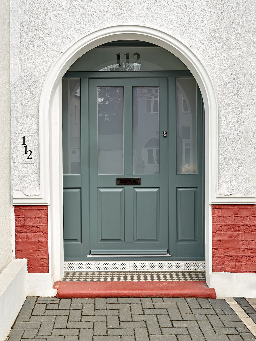 Wooden front door with hand made stained glass