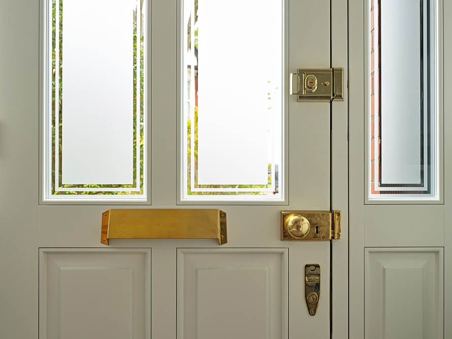 Wooden front door painted in Farrow and Ball paint