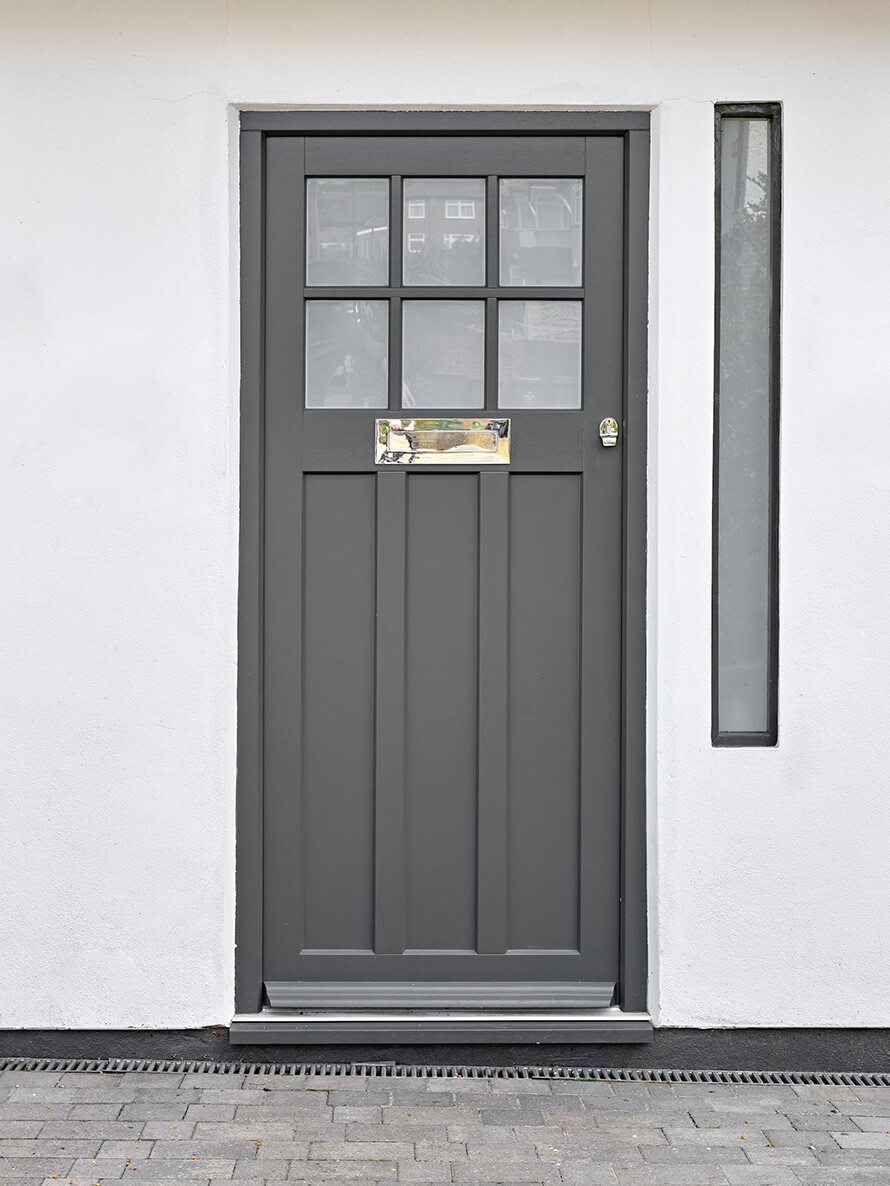 Bespoke timber entrance door in Clapham South London with Farrow and Ball Downpipe paint