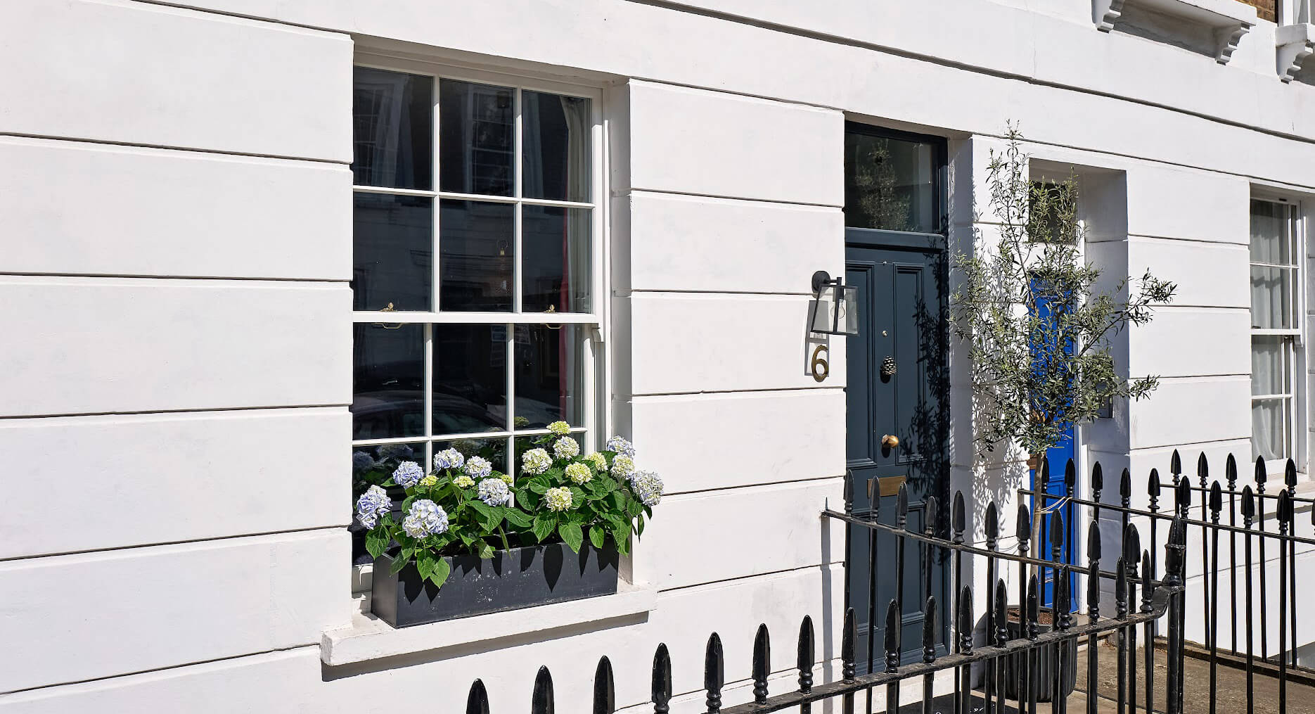 A grade 2 listed building with timber sash windows 