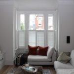 modern living room with large sash window in London property