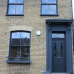 London Property with dark wood sash windows and door